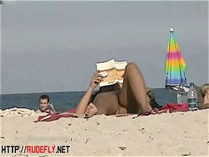 super-steamy honeys filmed lying on a nudist beach