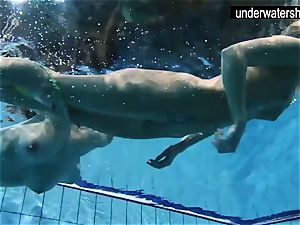 two sexy amateurs showing their bodies off under water